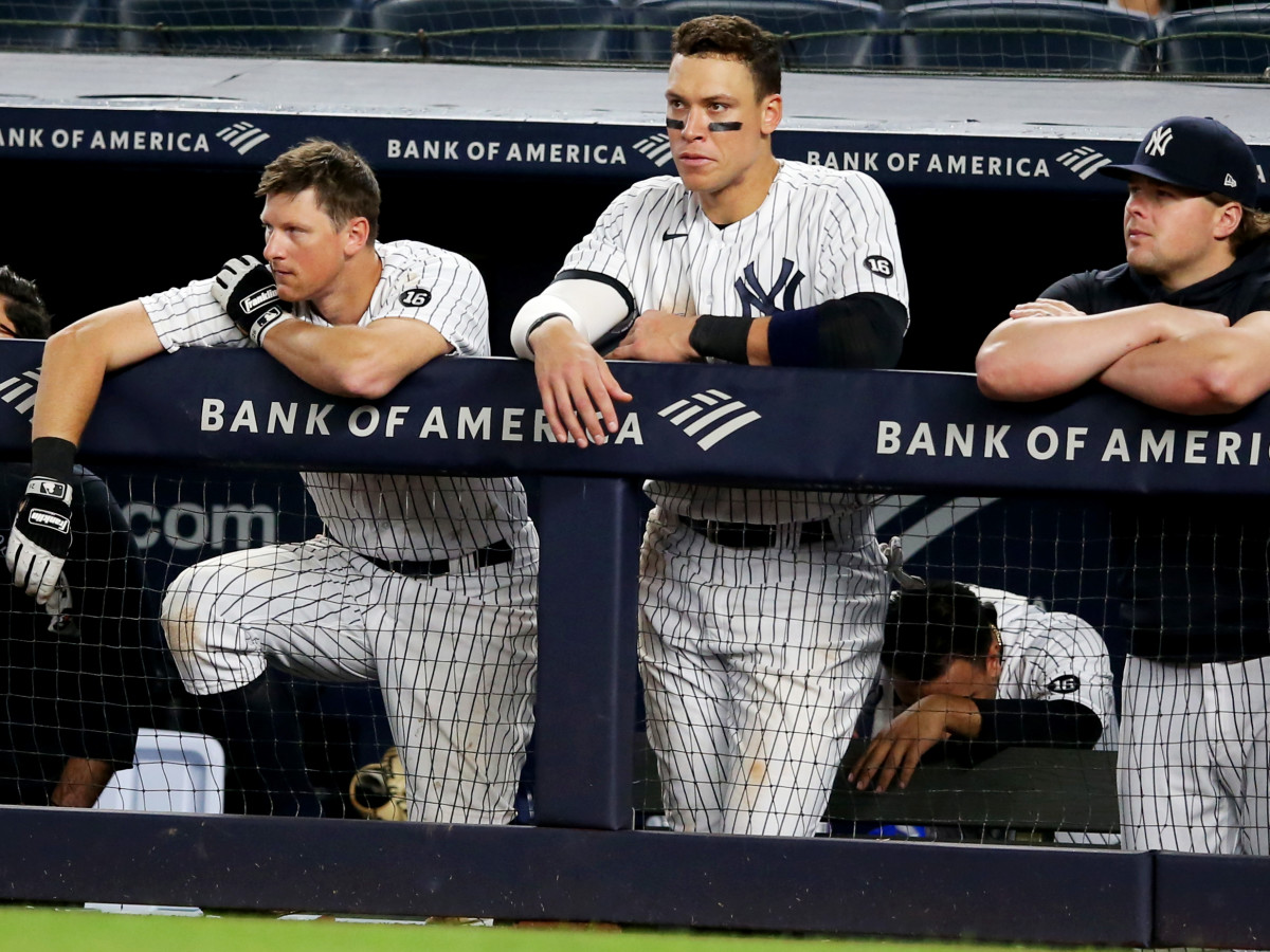 Jun 4, 2021; Bronx, New York, USA; New York Yankees first baseman DJ LeMahieu (26) and right fielder Aaron Judge (99) and injured first baseman Luke Voit (59) look on from the dugout during the ninth inning against the Boston Red Sox at Yankee Stadium.