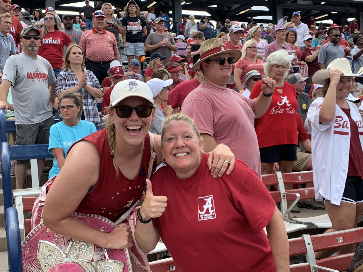 Alabama softball super fan Emily Pitek, left, with Colleen Cornell, mother of Crimson Tide pitcher Sarah Cornell