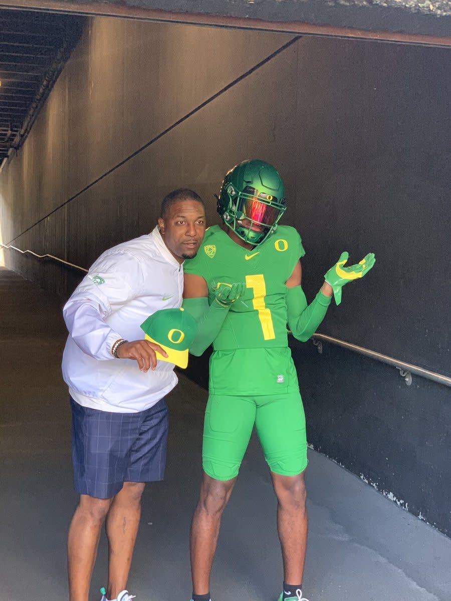 Stephon Johnson Jr. poses with Oregon Wide Receivers Coach Bryan McClendon on his official visit.