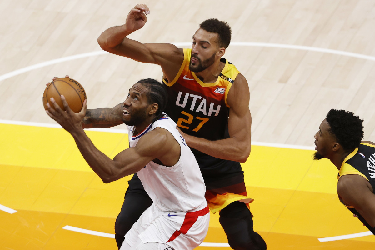 Jun 8, 2021; Salt Lake City, Utah, USA; LA Clippers forward Kawhi Leonard (2) drives to the hoop against Utah Jazz center Rudy Gobert (27) in the fourth quarter during game one in the second round of the 2021 NBA Playoffs. at Vivint Arena. Mandatory Credit: Jeffrey Swinger-USA TODAY Sports