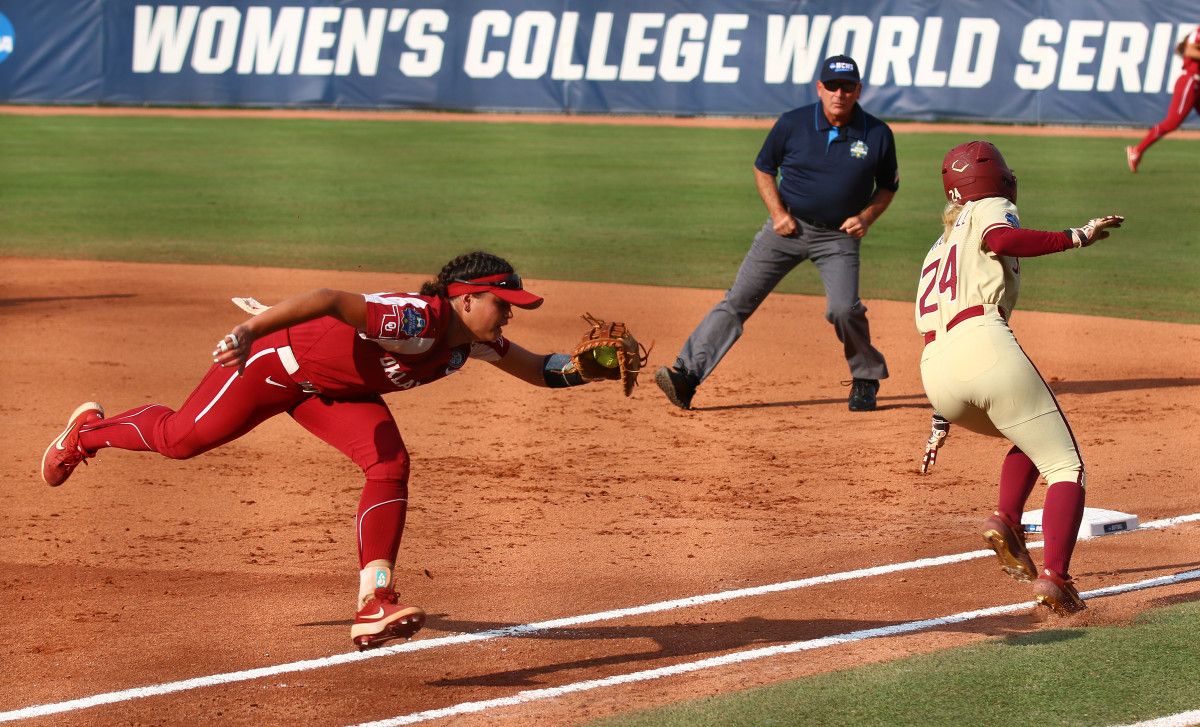 Sydney Sherrill avoids Taylon Snow's attempted tag in the bottom of the first inning