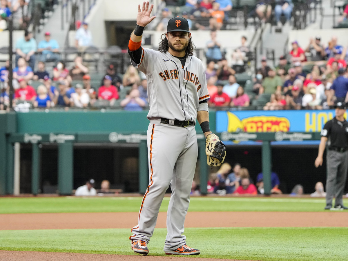 Jun 8, 2021; Arlington, Texas, USA; San Francisco Giants shortstop Brandon Crawford (35) is recognized as he takes the field for his 1,326th appearance at shortstop, setting a new record for the Giants, during the first inning against the Texas Rangers at Globe Life Field.