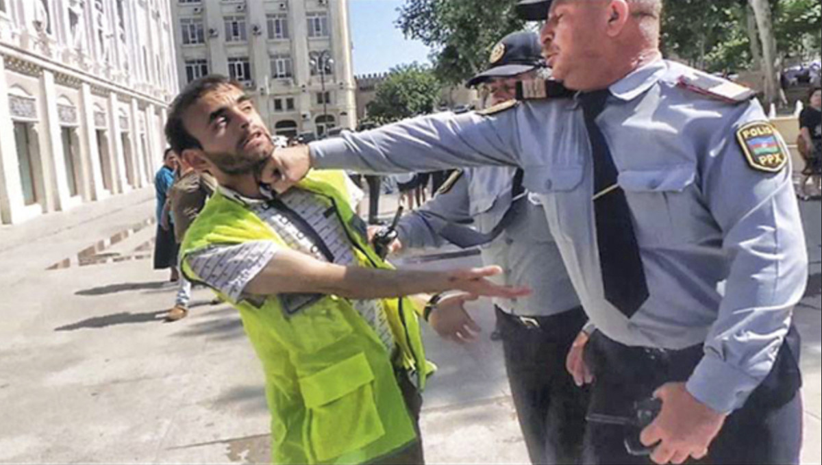 Aliyev went viral in 2013 after he was photographed being punched by a police officer at a protest.