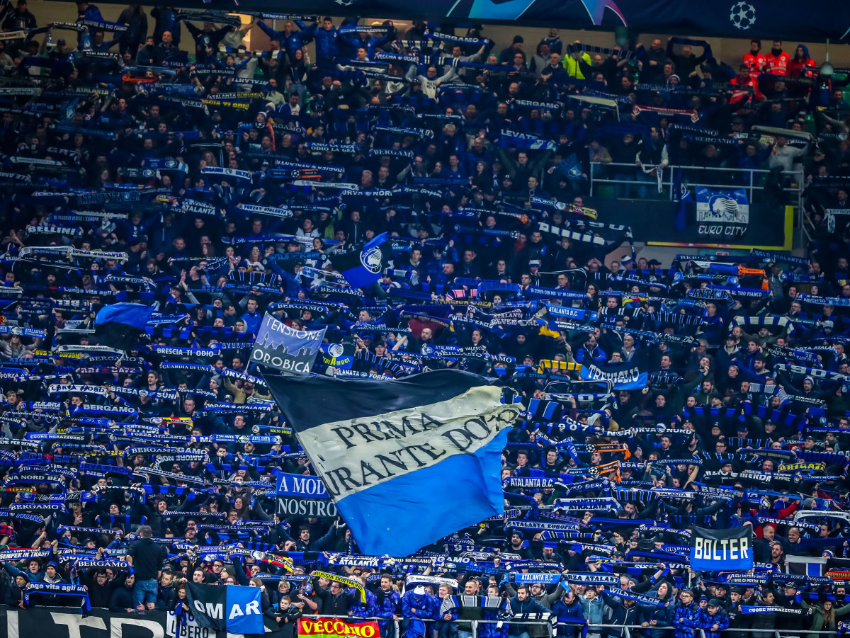 Atalanta BC supporters celebrate the victory during the Champions League 2019/20 match between Atalanta BC vs Valencia CF at the San Siro Stadium, Milan, Italy on February 19, 2020.