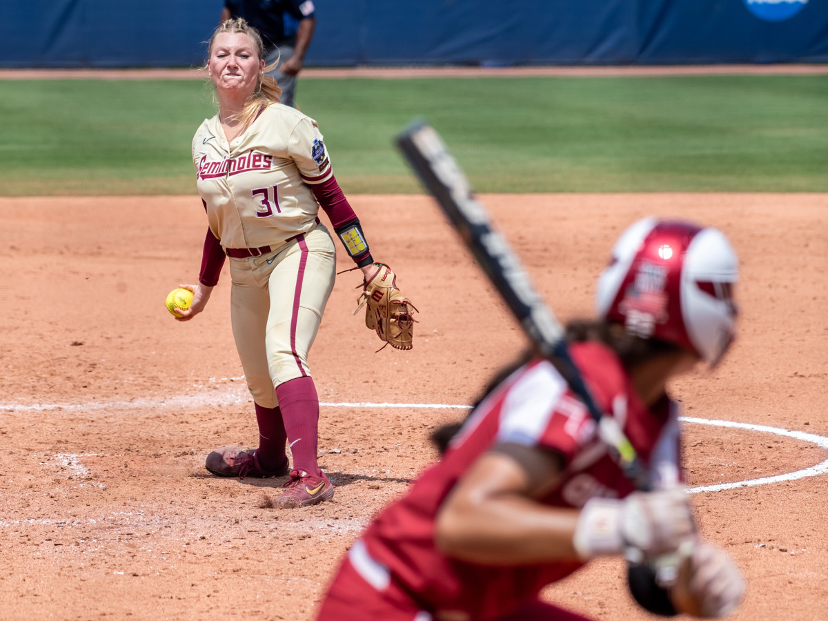 Jun 10, 2021; Oklahoma City, Oklahoma, USA; Florida State Seminoles starting pitcher/relief pitcher Danielle Watson (31) pitches to Oklahoma Sooners during the third inning during game three of the NCAA Womens College World Series Championship Series at USA Softball Hall of Fame Stadium.