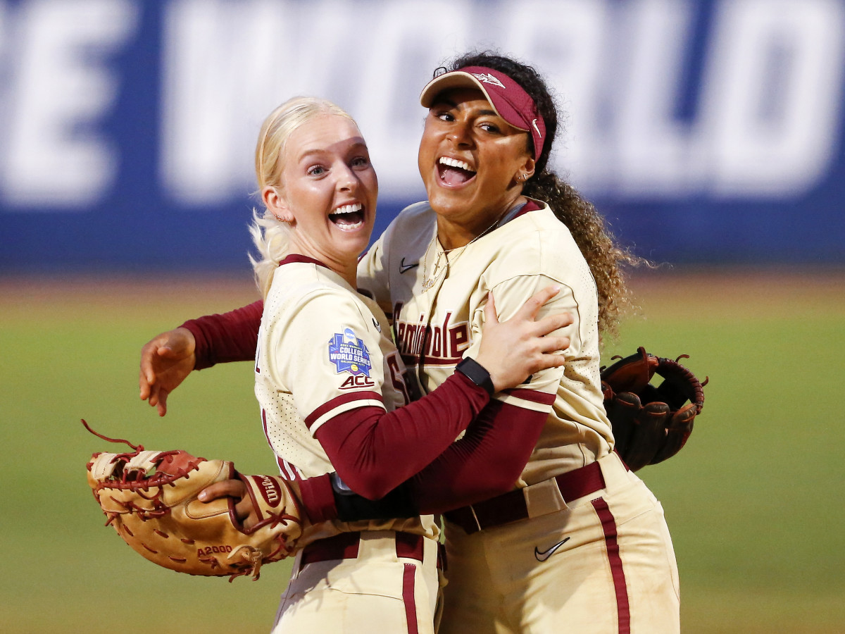 Jun 7, 2021; Oklahoma City, Oklahoma, USA; Florida State‚Äôs Sydney Sherrill (24) and Elizabeth Mason (5) celebrate after defeating Alabama during an NCAA Women's College World Series semi finals game at USA Softball Hall of Fame Stadium.