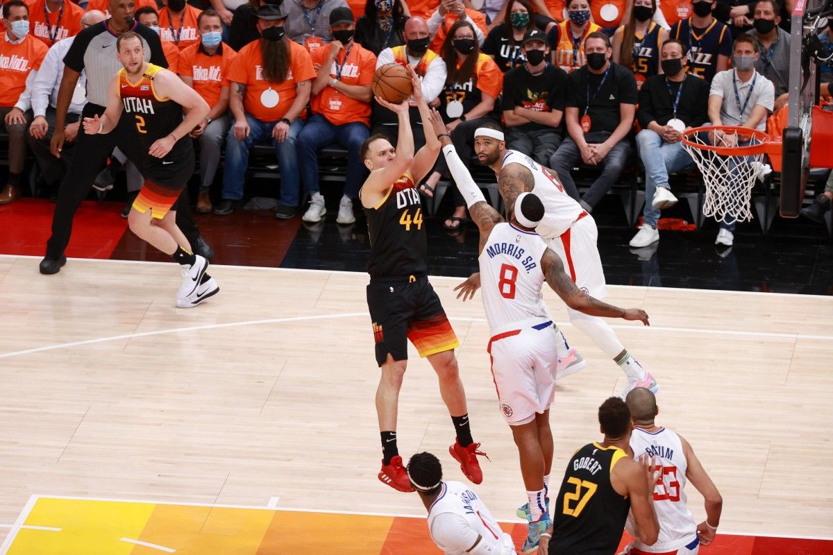 Bojan Bogdanovic (44) scores over Marcus Morris (8)
