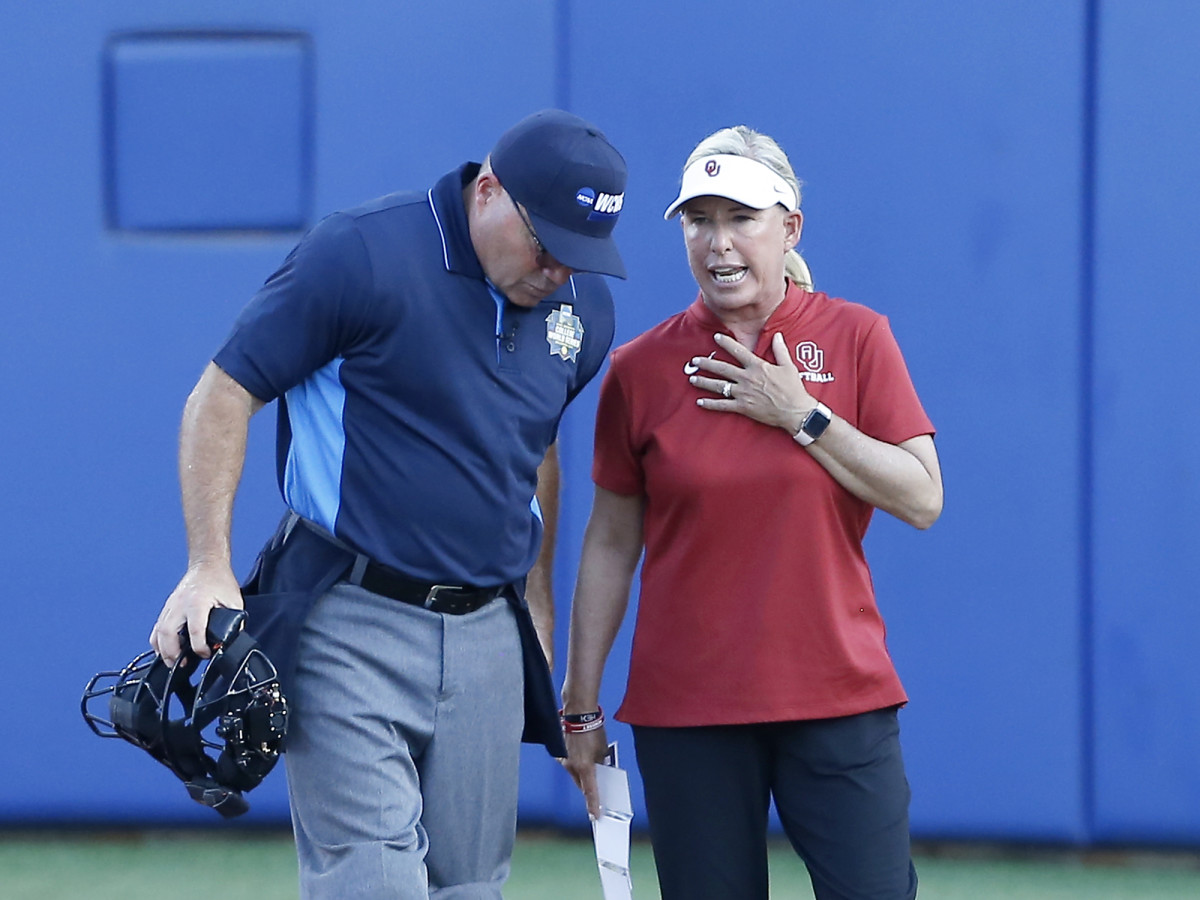 Jun 8, 2021; Oklahoma City, Oklahoma, USA; Oklahoma head coach Patty Gasso talks to the umpire during game one of the NCAA Women’s College World Series Championship Series against Florida State at USA Softball Hall of Fame Stadium.