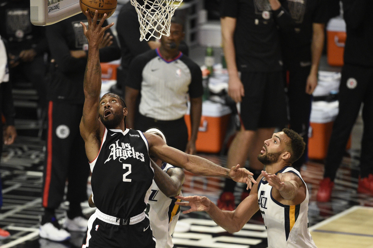 Jun 12, 2021; Los Angeles, California, USA; LA Clippers forward Kawhi Leonard (2) goes up for a shot in front of Utah Jazz center Rudy Gobert (27) in the third quarter during game three in the second round of the 2021 NBA Playoffs. at Staples Center. Mandatory Credit: Kelvin Kuo-USA TODAY Sports