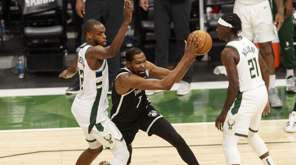 Khris Middleton, Kevin Durant and Jrue Holiday