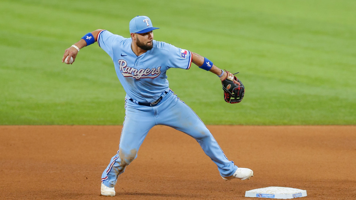 Jun 6, 2021; Arlington, Texas, USA; Texas Rangers third baseman Isiah Kiner-Falefa (9) turns an unassisted double play during the fifth inning against the Tampa Bay Rays at Globe Life Field.