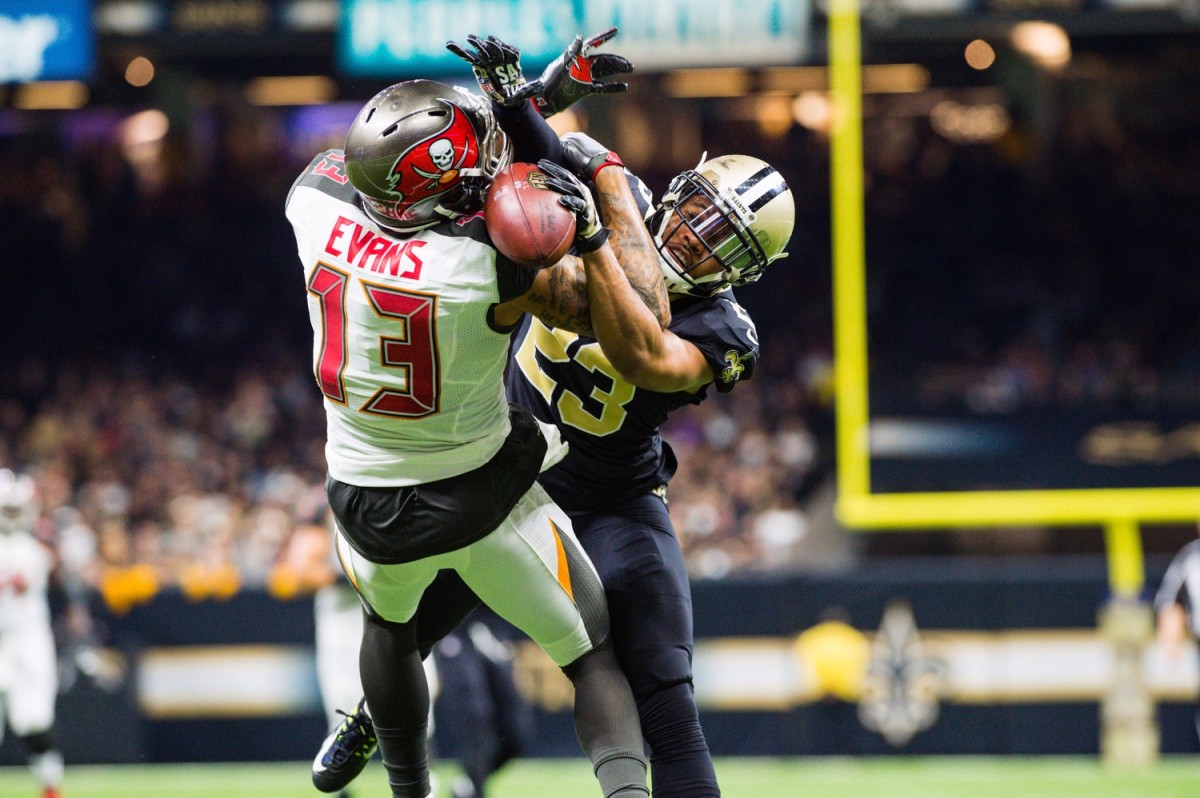 New Orleans Saints cornerback Marshon Lattimore breaks up a pass thrown to Tampa Bay receiver Mike Evans. Mandatory Credit: Scott Clause/The Daily Advertiser via USA TODAY NETWORK