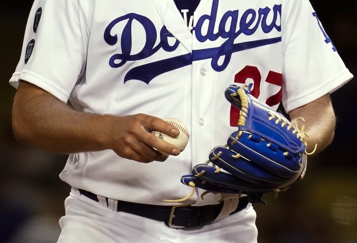 Jun 12, 2021; Los Angeles, California, USA; Los Angeles Dodgers starting pitcher Trevor Bauer grips the ball before throwing a pitch against the Texas Rangers in the seventh inning at Dodger Stadium.