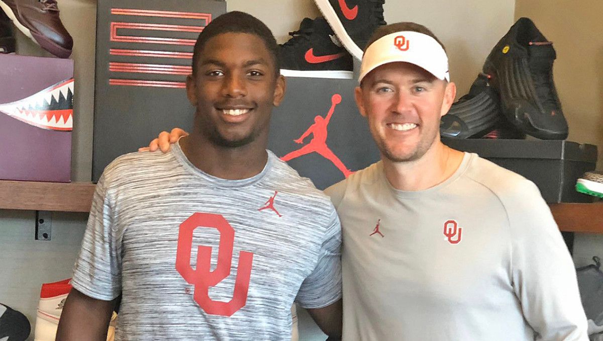 Kobie McKinzie and OU head coach Lincoln Riley