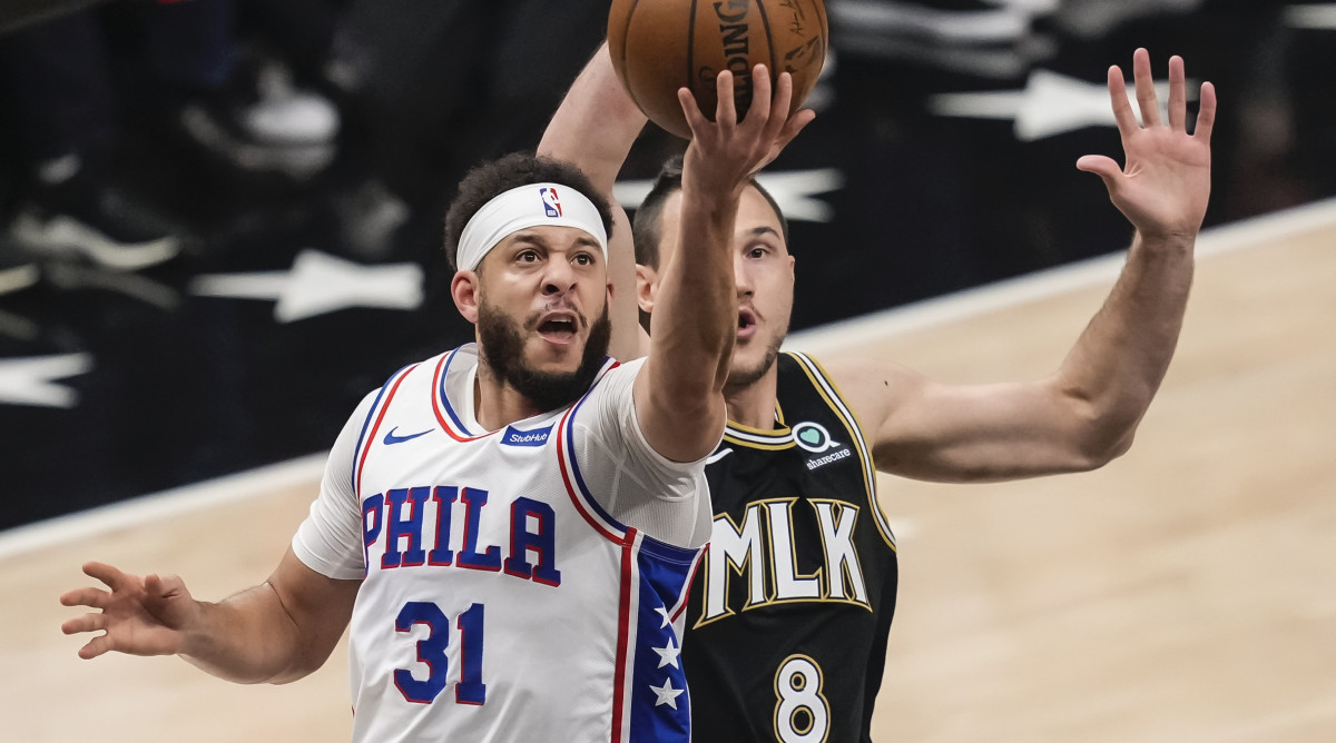 Philadelphia 76ers guard Seth Curry (31) drives to the basket against Atlanta Hawks forward Danilo Gallinari (8) during the first quarter in game six in the second round of the 2021 NBA Playoffs