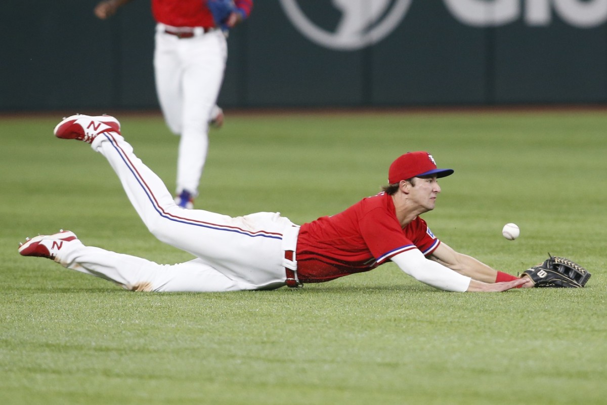Jun 18, 2021; Arlington, Texas, USA; Texas Rangers left fielder Eli White (41) cannot catch a ball hit by Minnesota Twins catcher Ryan Jeffers (not pictured) in the ninth inning at Globe Life Field.