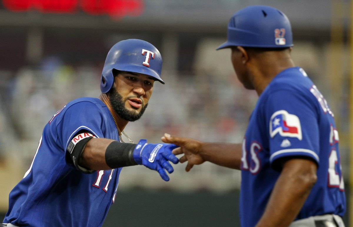Aug 5, 2017; Minneapolis, MN, USA; Texas Rangers right fielder Nomar Mazara (30) celebrates with third base coach Tony Beasley after hitting a home run against the Minnesota Twins in the first inning at Target Field.