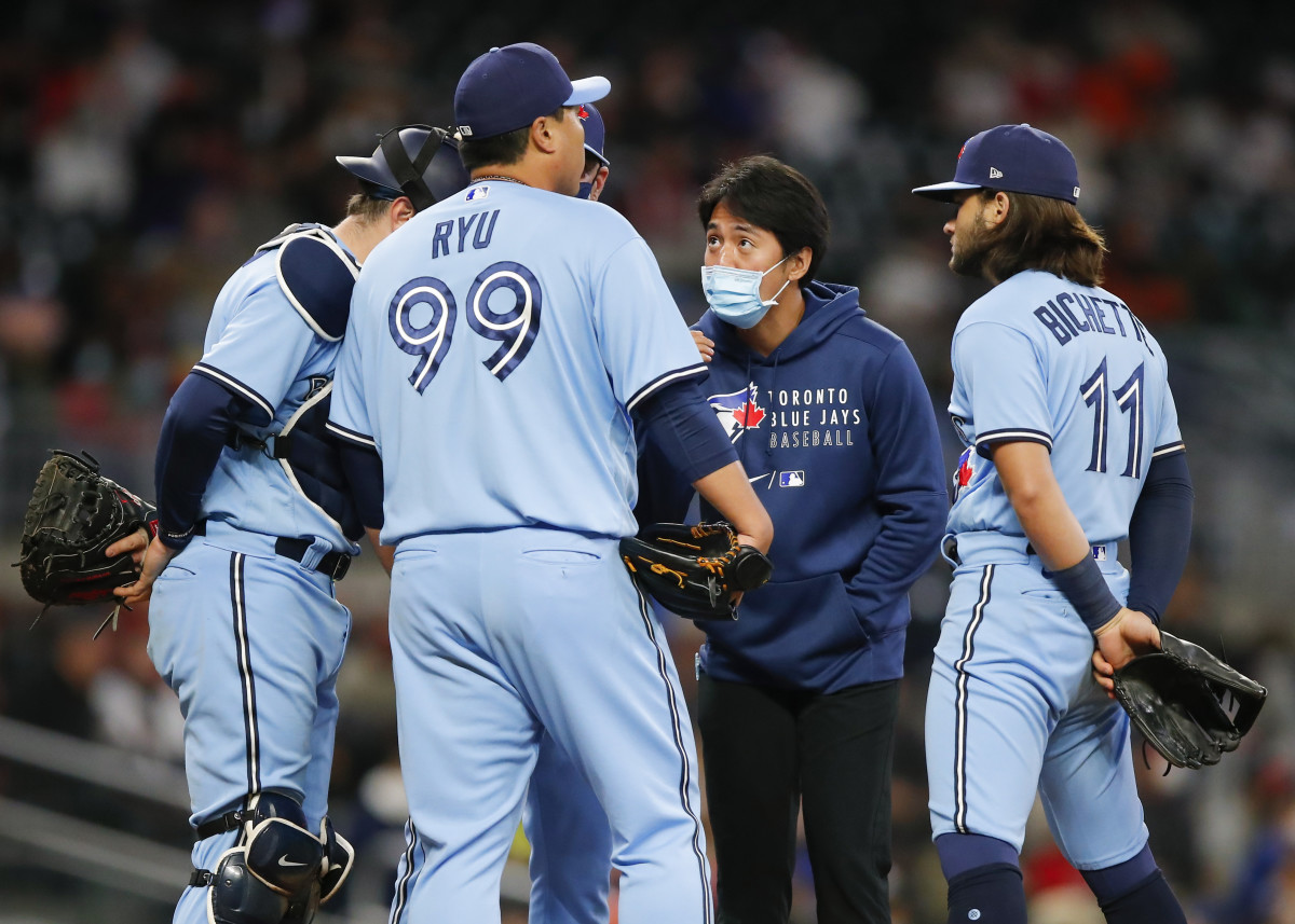 Hyun Jin Ryu during a mound visit with his interpreter Jun Sung Park