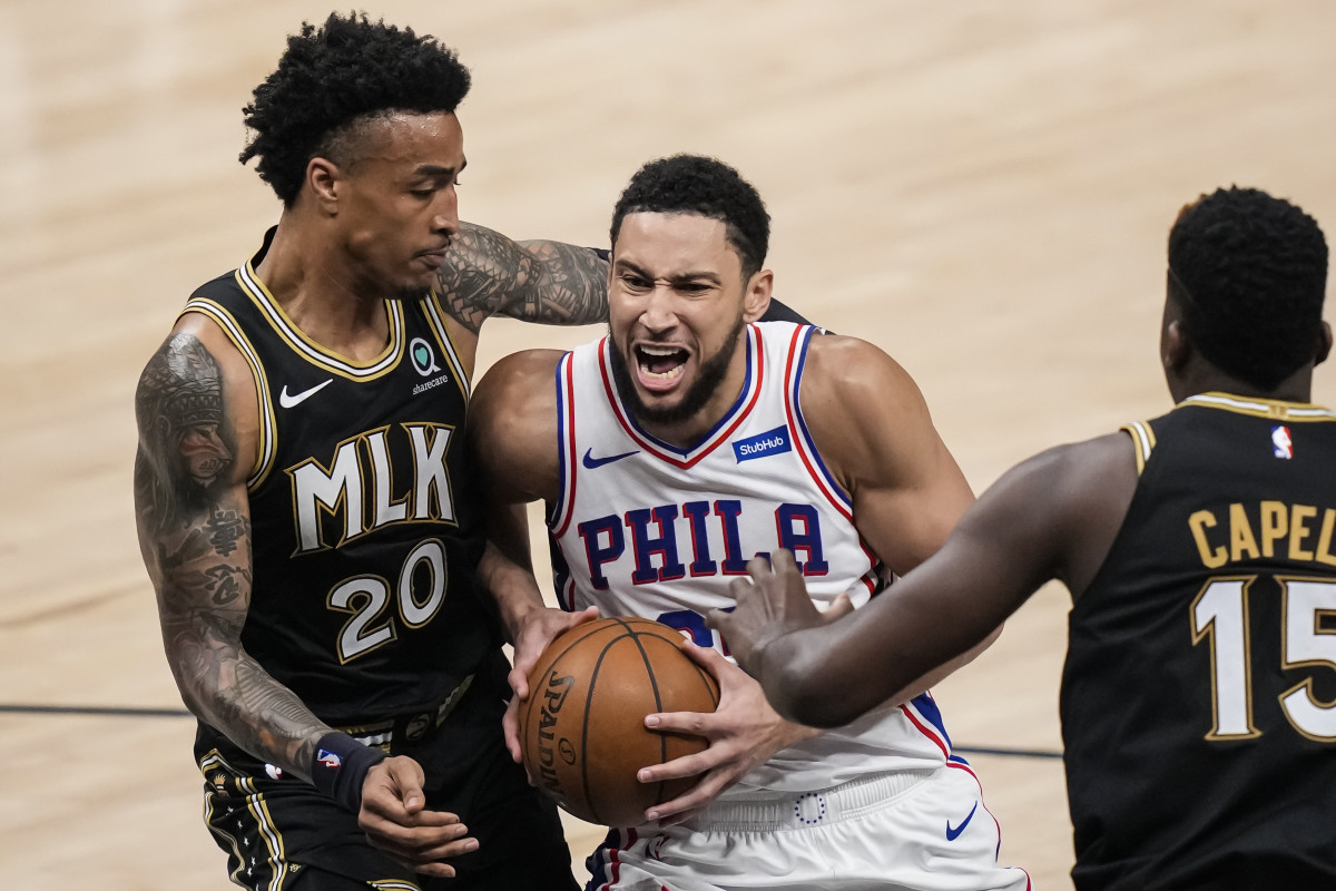 Jun 18, 2021; Atlanta, Georgia, USA; Philadelphia 76ers guard Ben Simmons (25) drives to the basket against Atlanta Hawks forward John Collins (20) during the first half in game six in the second round of the 2021 NBA Playoffs. at State Farm Arena.