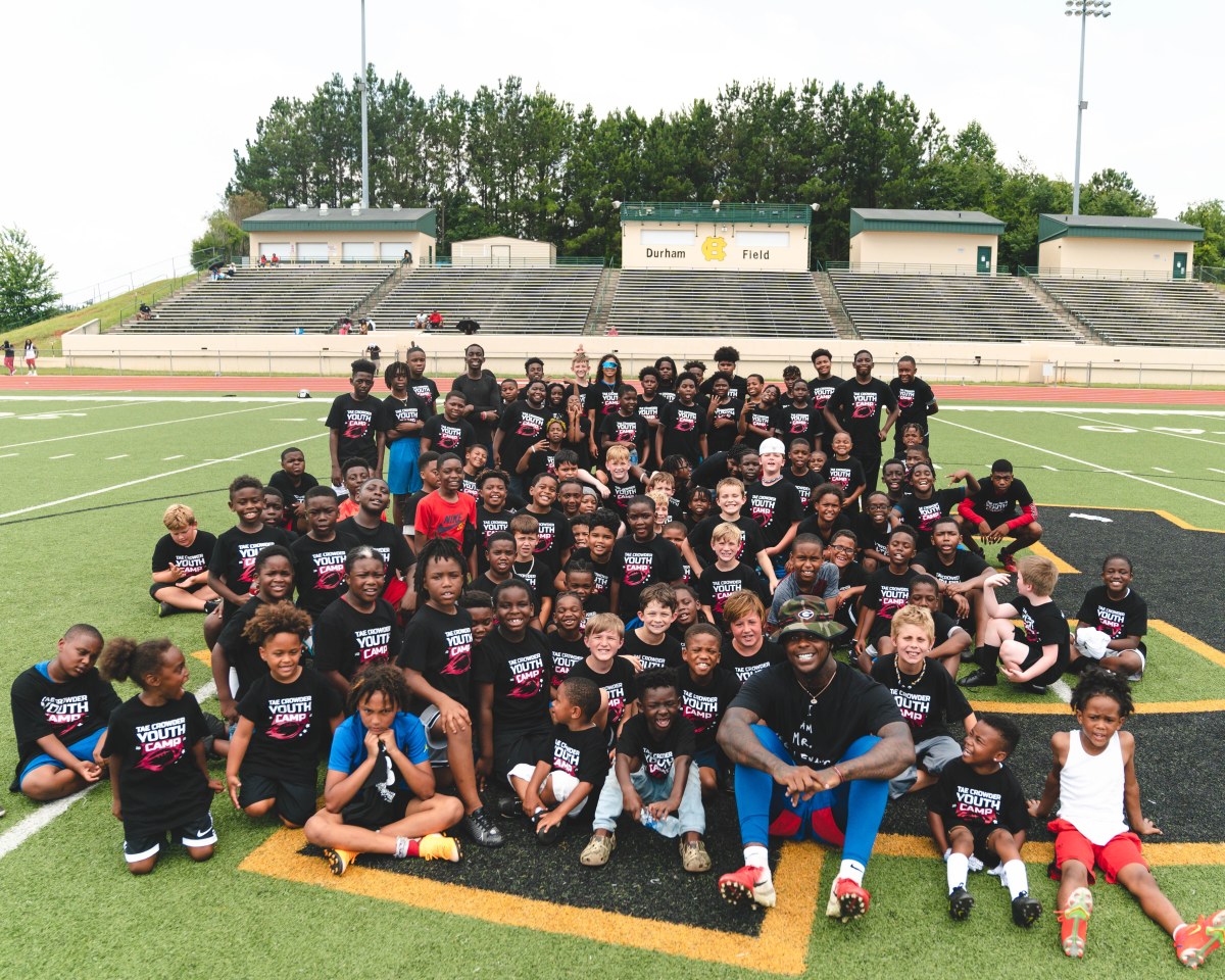 Giants linebacker Tae Crowder poses with the young campers who attended his recent one-day football youth camp in Georgia.