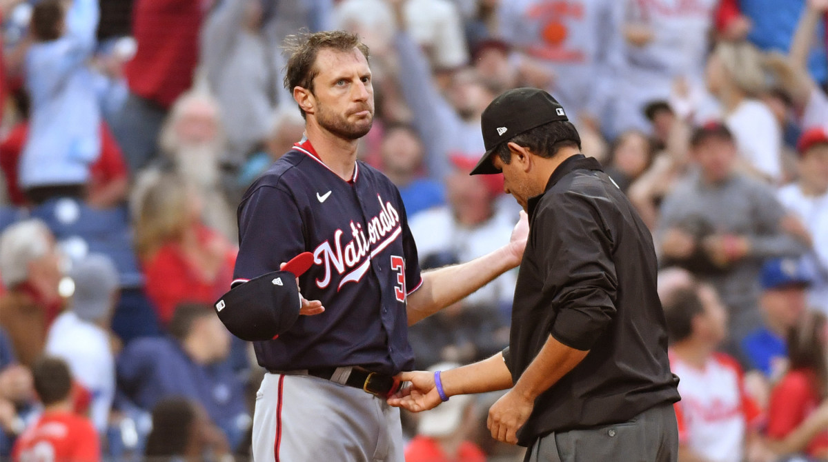 Jun 22, 2021; Philadelphia, Pennsylvania, USA; Washington Nationals pitcher Max Scherzer (31) has his belt checked after he pitched the first inning against the Philadelphia Phillies at Citizens Bank Park.