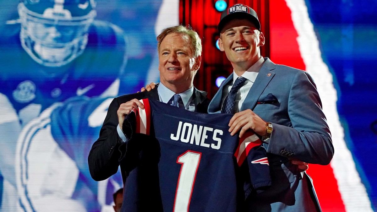 Mac Jones (Alabama) with NFL commissioner Roger Goodell after being selected by the New England Patriots as the number 15 overall pick in the first round of the 2021 NFL Draft at First Energy Stadium.