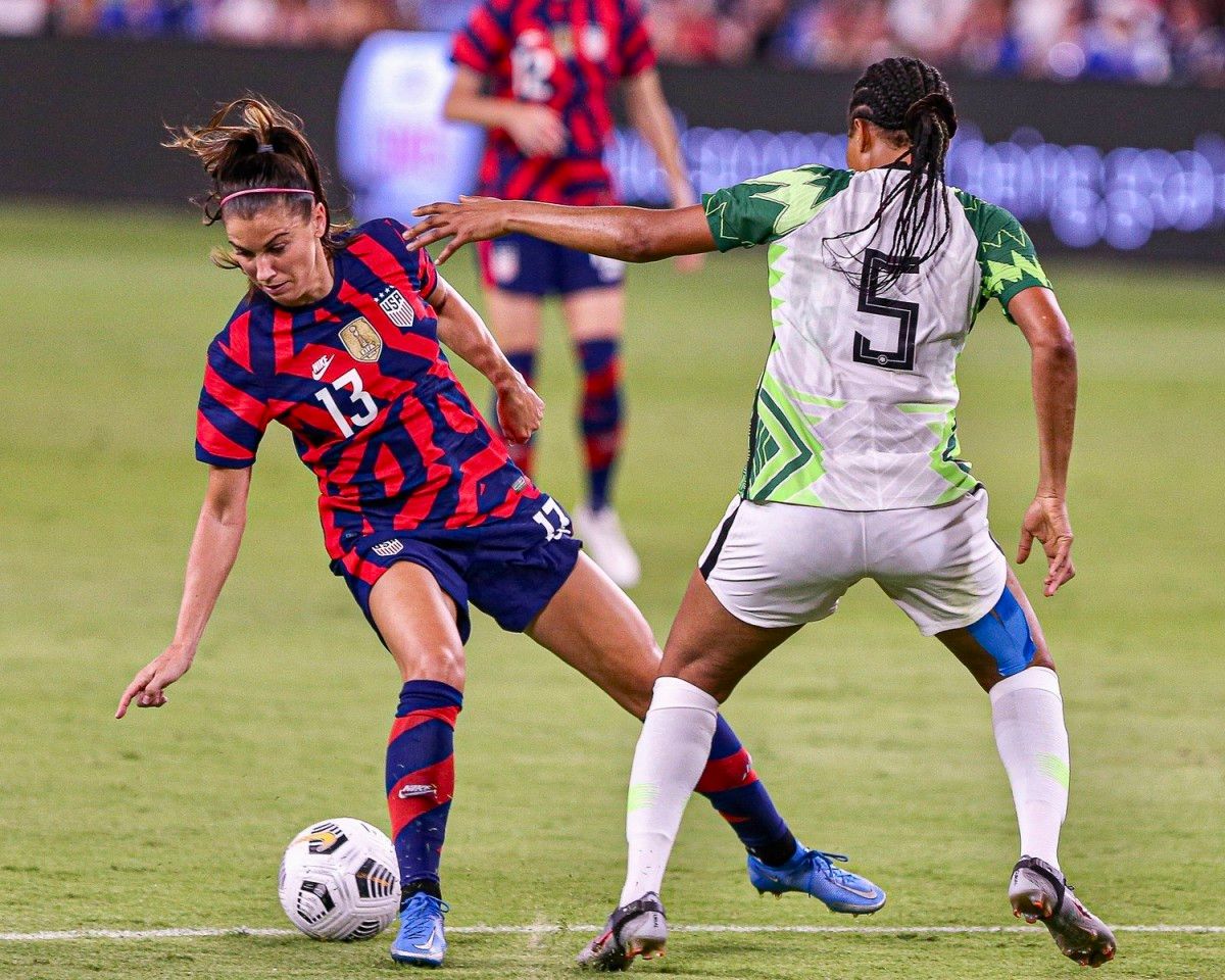 Alex Morgan, left, in action against Nigeria this year