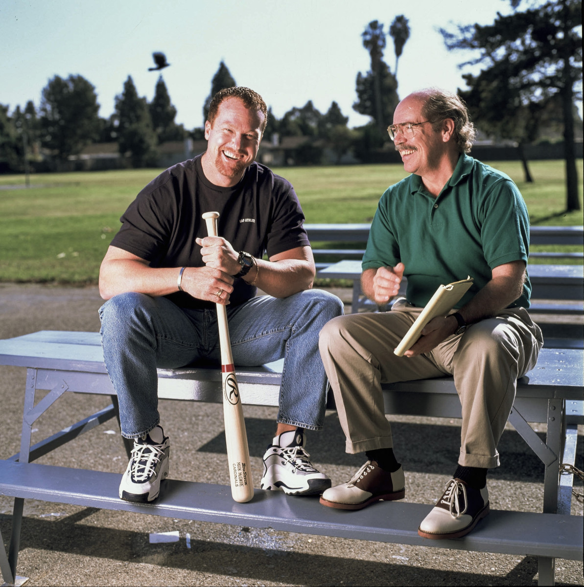 Kindred and Mark McGwire, for a Sporting News story, in 1997.