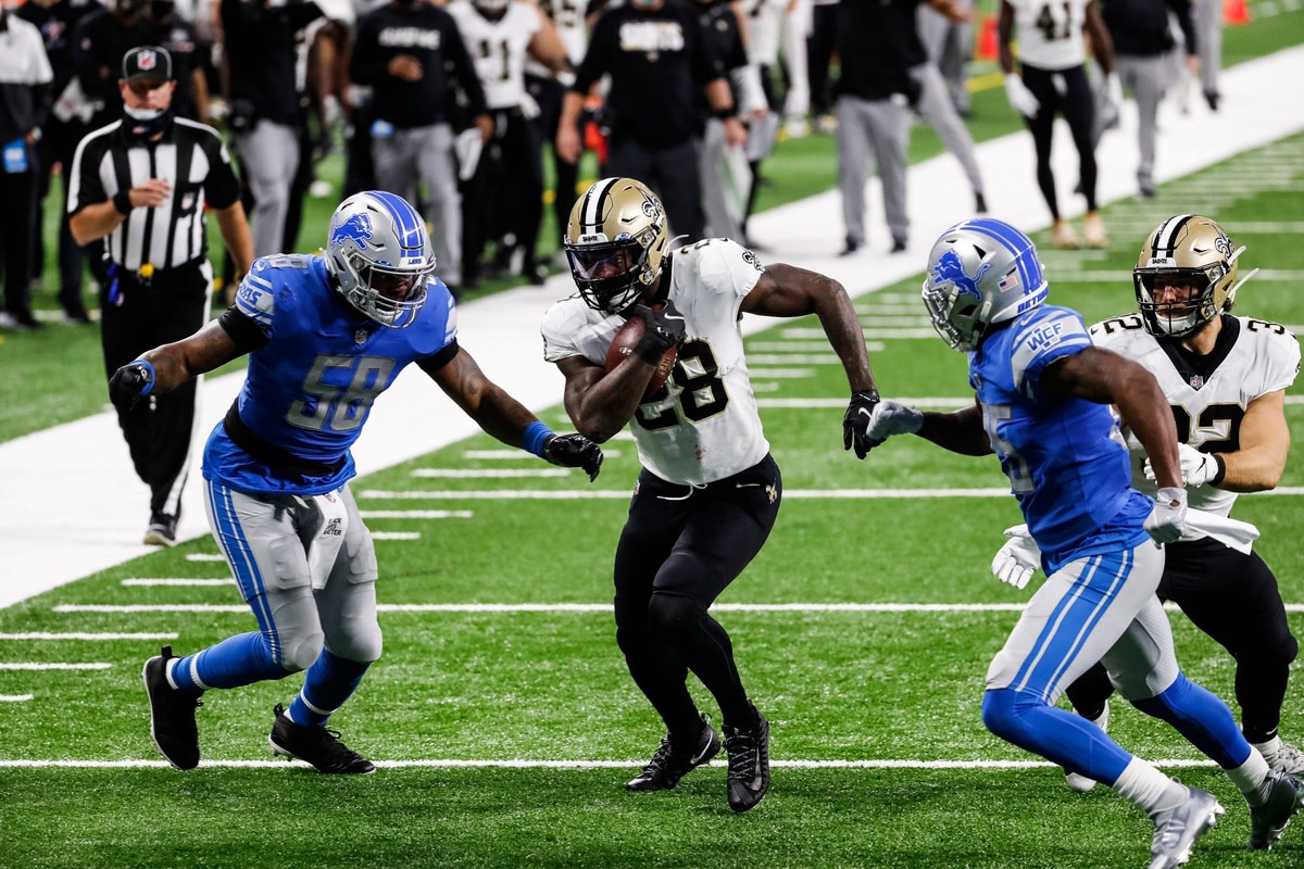 New Orleans Saints running back Latavius Murray runs against Detroit linebacker Jamie Collins (58). © Junfu Han via Imagn Content Services, LLC