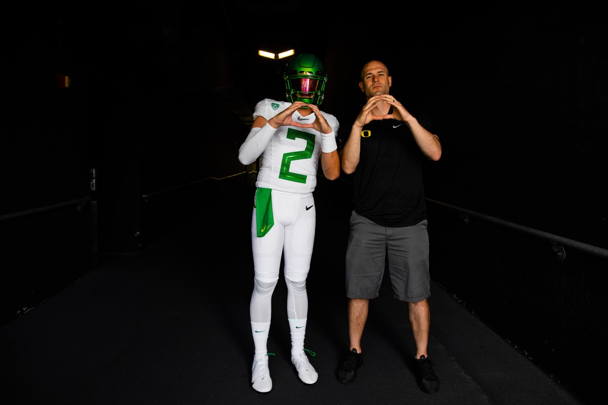 Bailey throws up an O with Nate Costa during his visit.