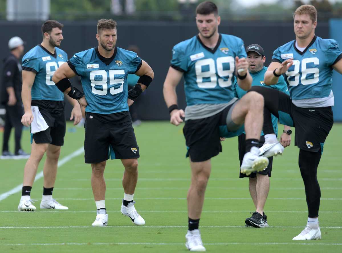 Tim Tebow (85) watches as fellow Jaguars tight ends go through drills. © Bob Self/Florida Times-Union