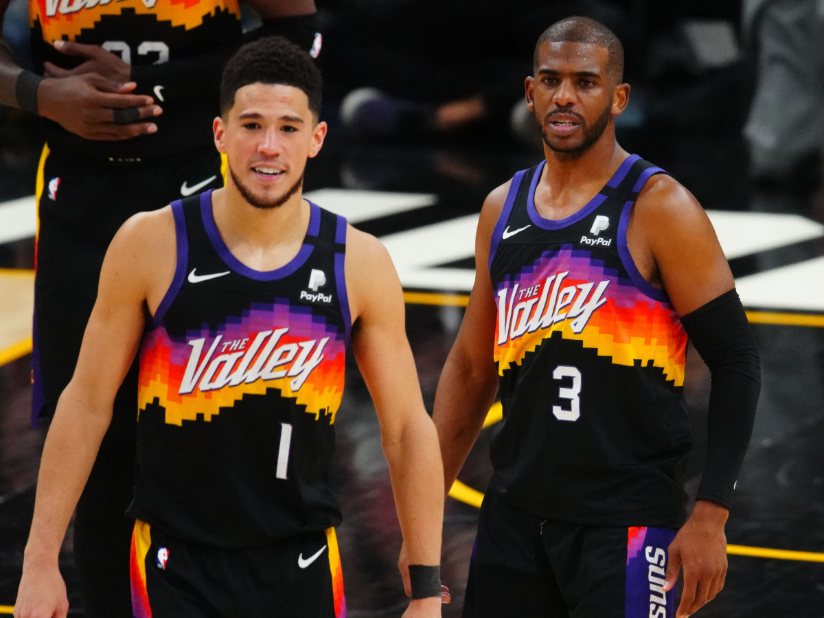 Phoenix Suns guard Chris Paul (3) and Devin Booker (1) against the Denver Nuggets during game two in the second round of the 2021 NBA Playoffs