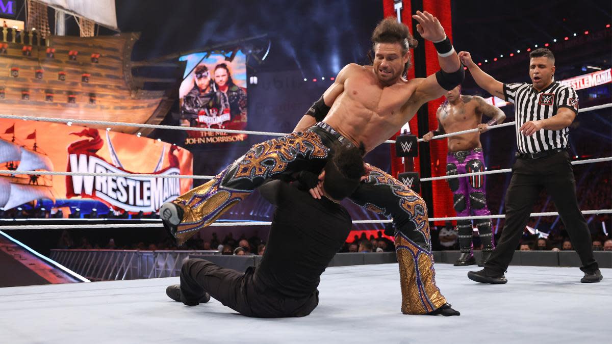 WWE's John Morrison delivers a kick to Bad Bunny