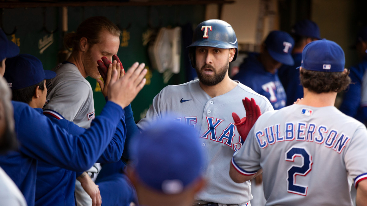Jun 29, 2021; Oakland, California, USA; Texas Rangers right fielder Joey Gallo is greeted by his teammates after hitting a solo home run against the Oakland Athletics during the fourth inning at RingCentral Coliseum.