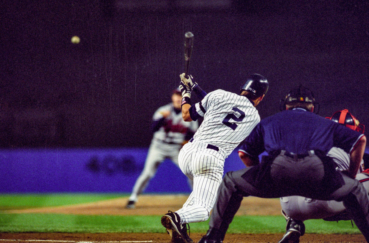 Derek Jeter hits an RBI single in Game 6 of the 1996 World Series at Yankee Stadium.