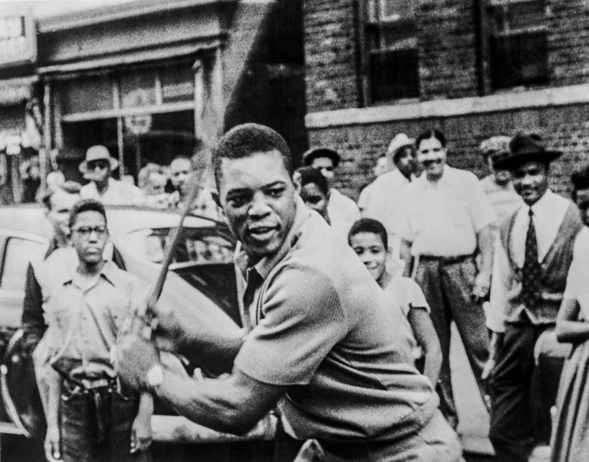 Willie Mays playing stick ball with kids in Harlem, N.Y.