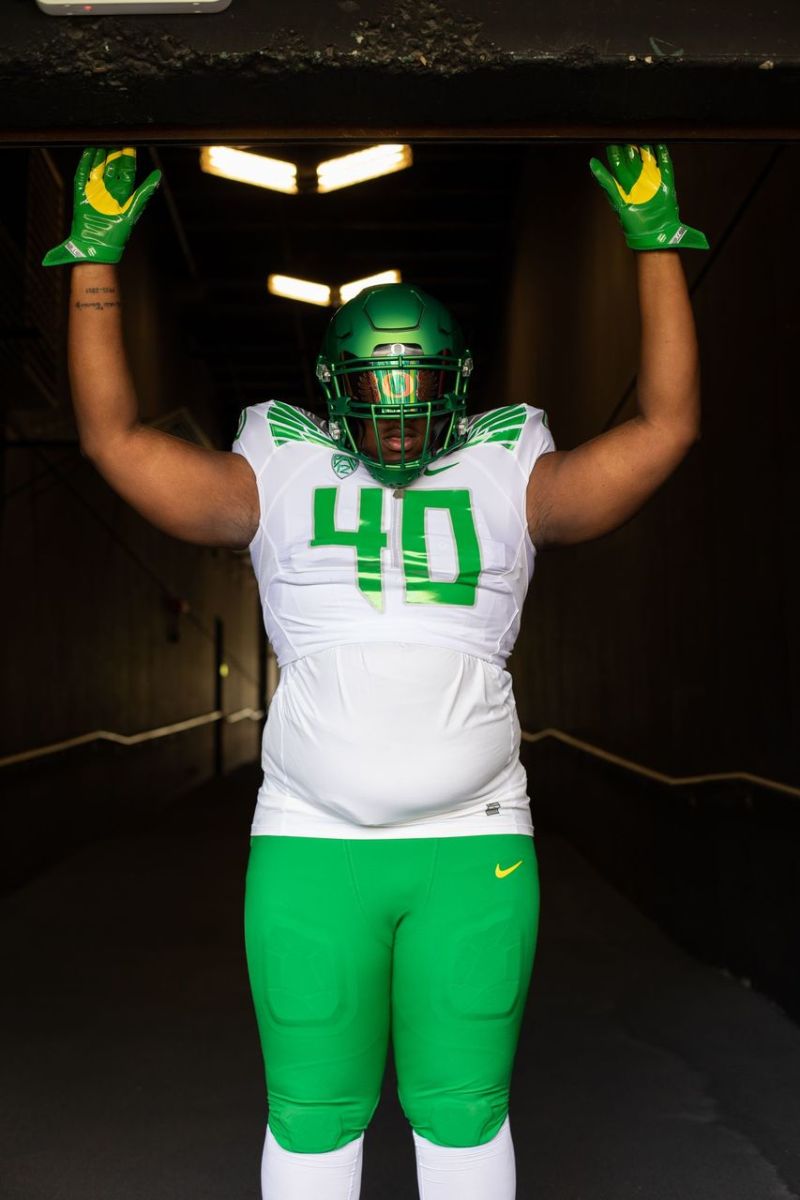 Sir Mells wears an Oregon uniform in the tunnel leading into Autzen Stadium.