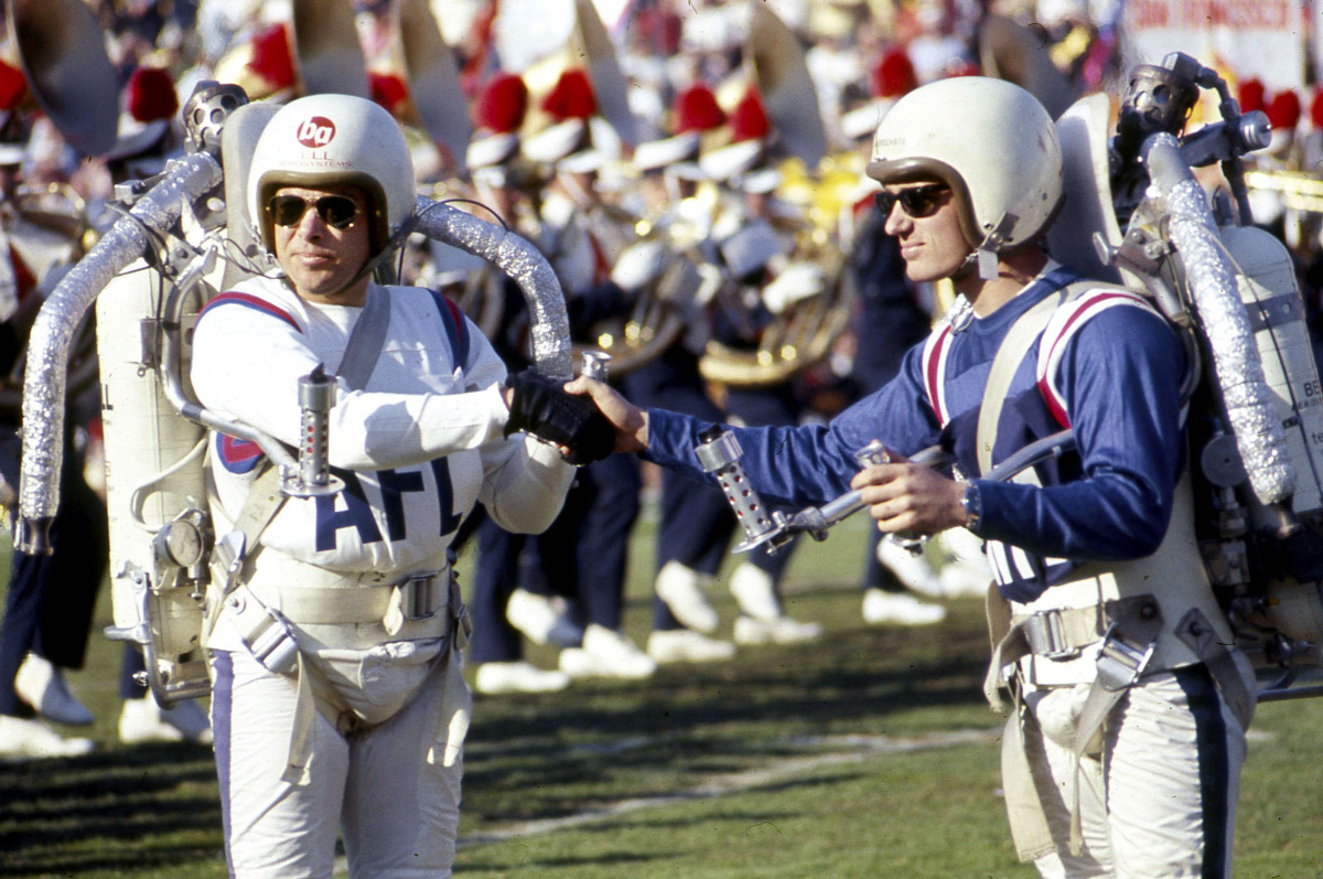 Bob Courter and Willy Suitor, representing the AFL and NFL, came together to soar into the sky at Super Bowl I.