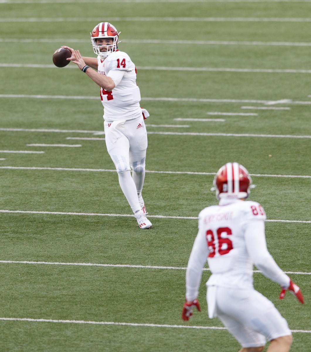 Indiana quarterback Jack Tuttle (14) throws a pass to tight end Peyton Hendershot (86) against  Wisconsin. (Jeff Hanisch-USA TODAY Sports)