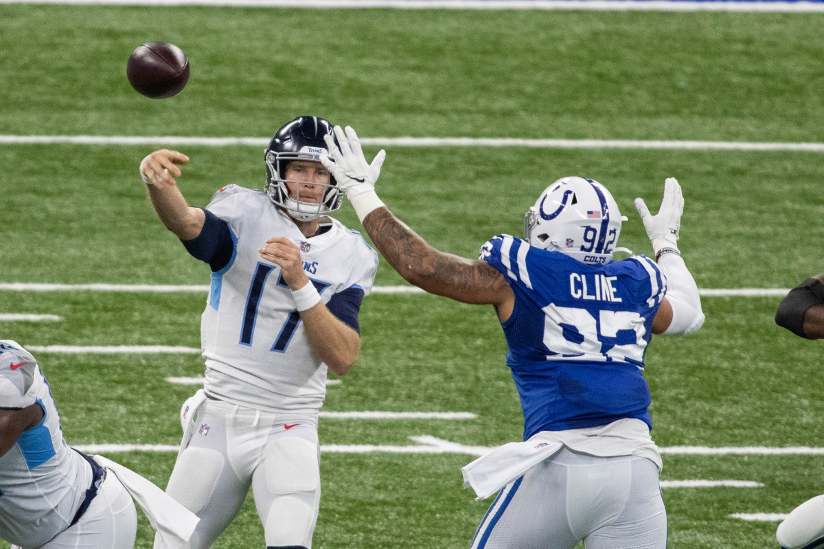 Nov 29, 2020; Indianapolis, Indiana, USA; Tennessee Titans quarterback Ryan Tannehill (17) passes the ball while Indianapolis Colts defensive tackle Kameron Cline (92) defends in the first half at Lucas Oil Stadium.