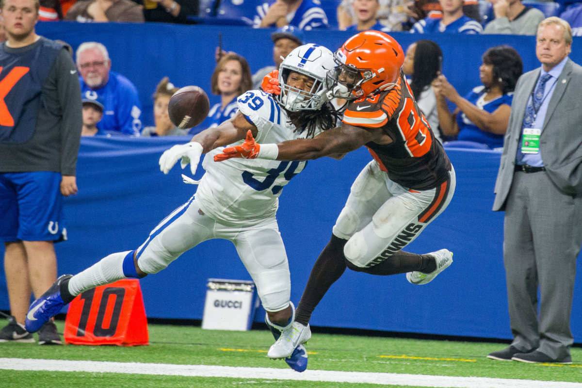 Aug 17, 2019; Indianapolis, IN, USA; Cleveland Browns wide receiver D.J. Montgomery (83) and Indianapolis Colts cornerback Marvell Tell (39) fight for a passed ball in the second half of the game at Lucas Oil Stadium.