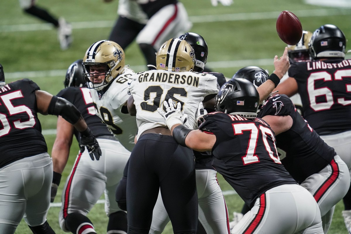 New Orleans defensive end Carl Granderson (96) hits Falcons quarterback Matt Ryan (2) causing a fumble recovered by the Saints. Mandatory Credit: Dale Zanine-USA TODAY 