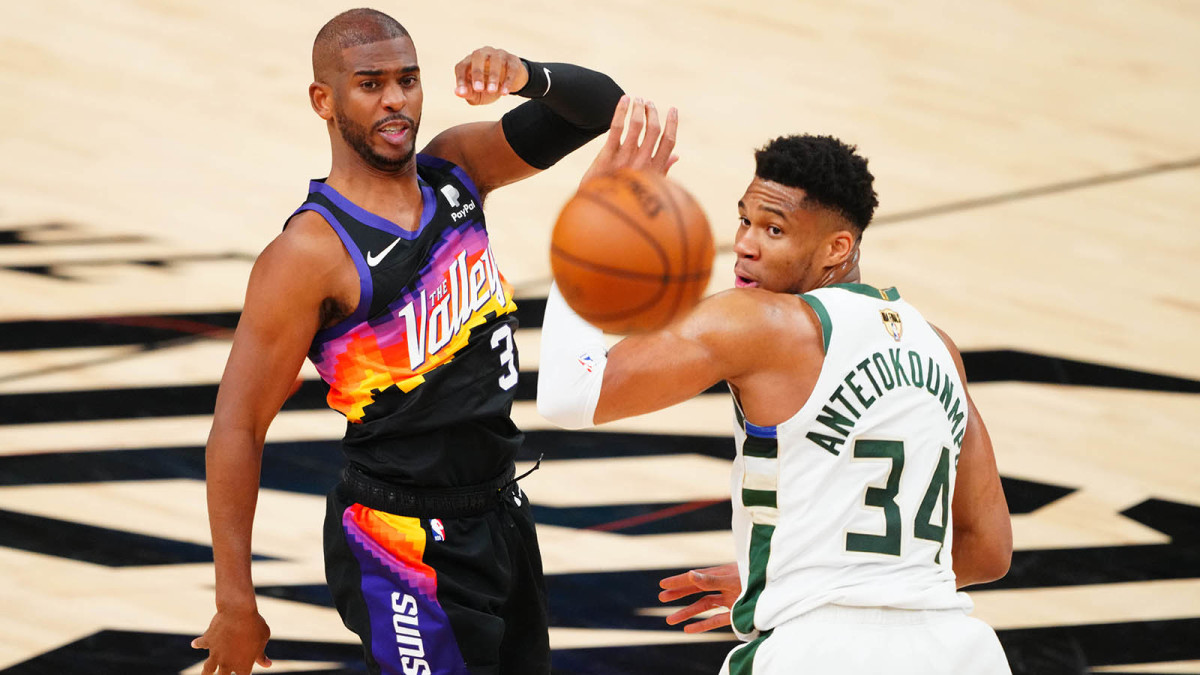 Phoenix Suns guard Chris Paul (3) passes the ball against Milwaukee Bucks forward Giannis Antetokounmpo