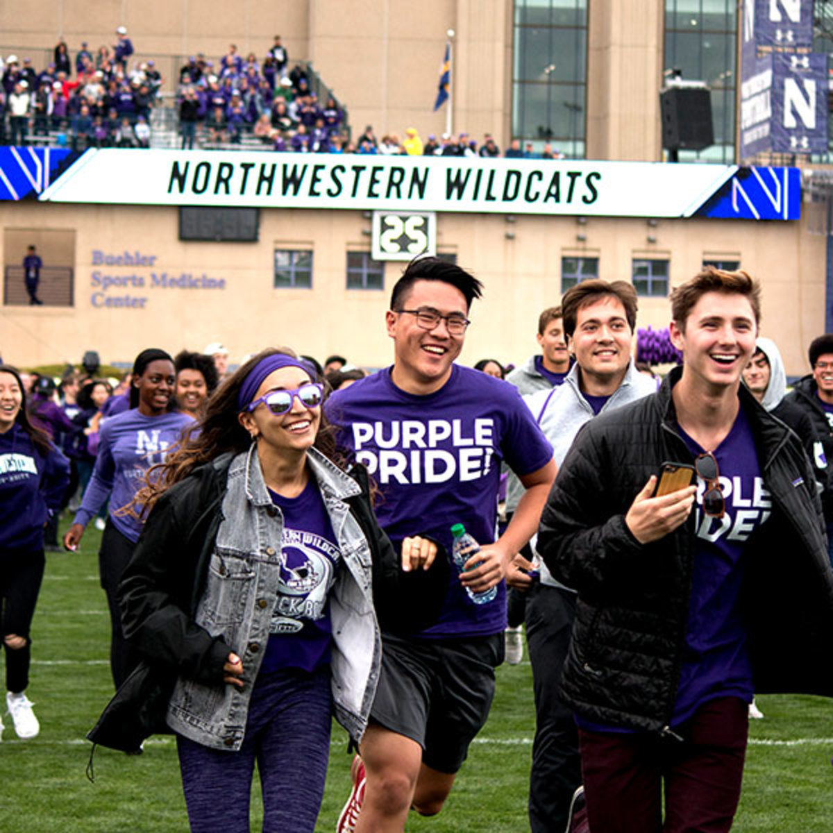 Freshmen students are leading the charge as they run out with the football team at Ryan Field.