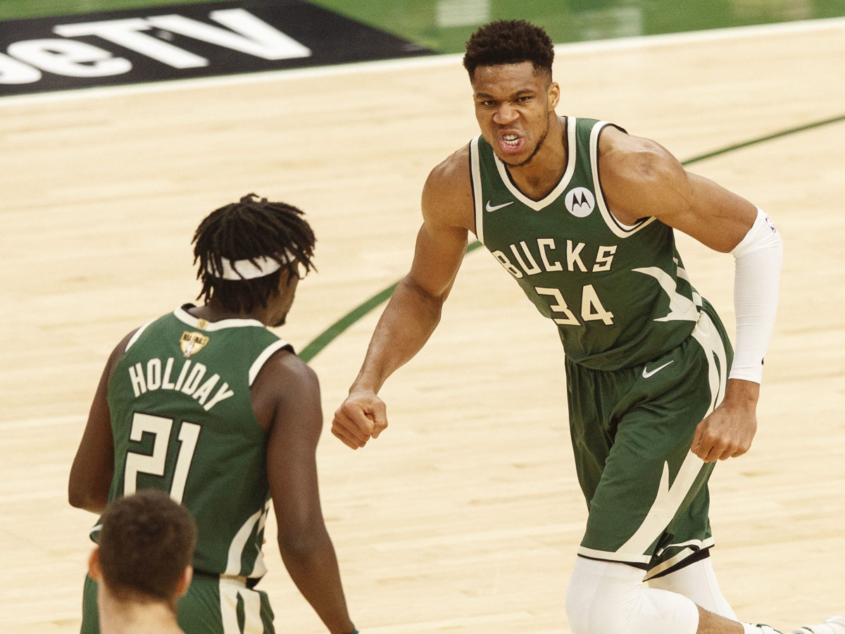 Milwaukee Bucks forward Giannis Antetokounmpo (34) reacts following a basket during the third quarter against the Phoenix Suns during game three of the 2021 NBA Finals at Fiserv Forum.
