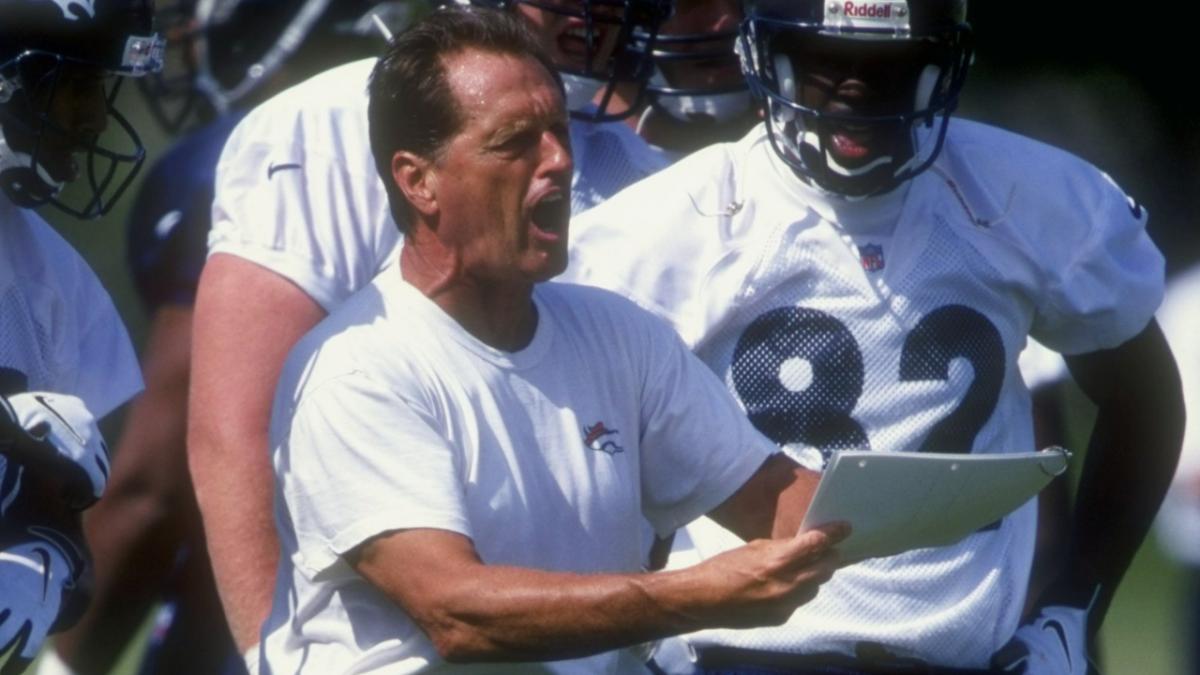 26 Jul 1998: Offensive line coach Alex Gibbs of the Denver Broncos discusses a play during the Broncos training camp at the University of Northern Colorado in Greeley, Colorado.