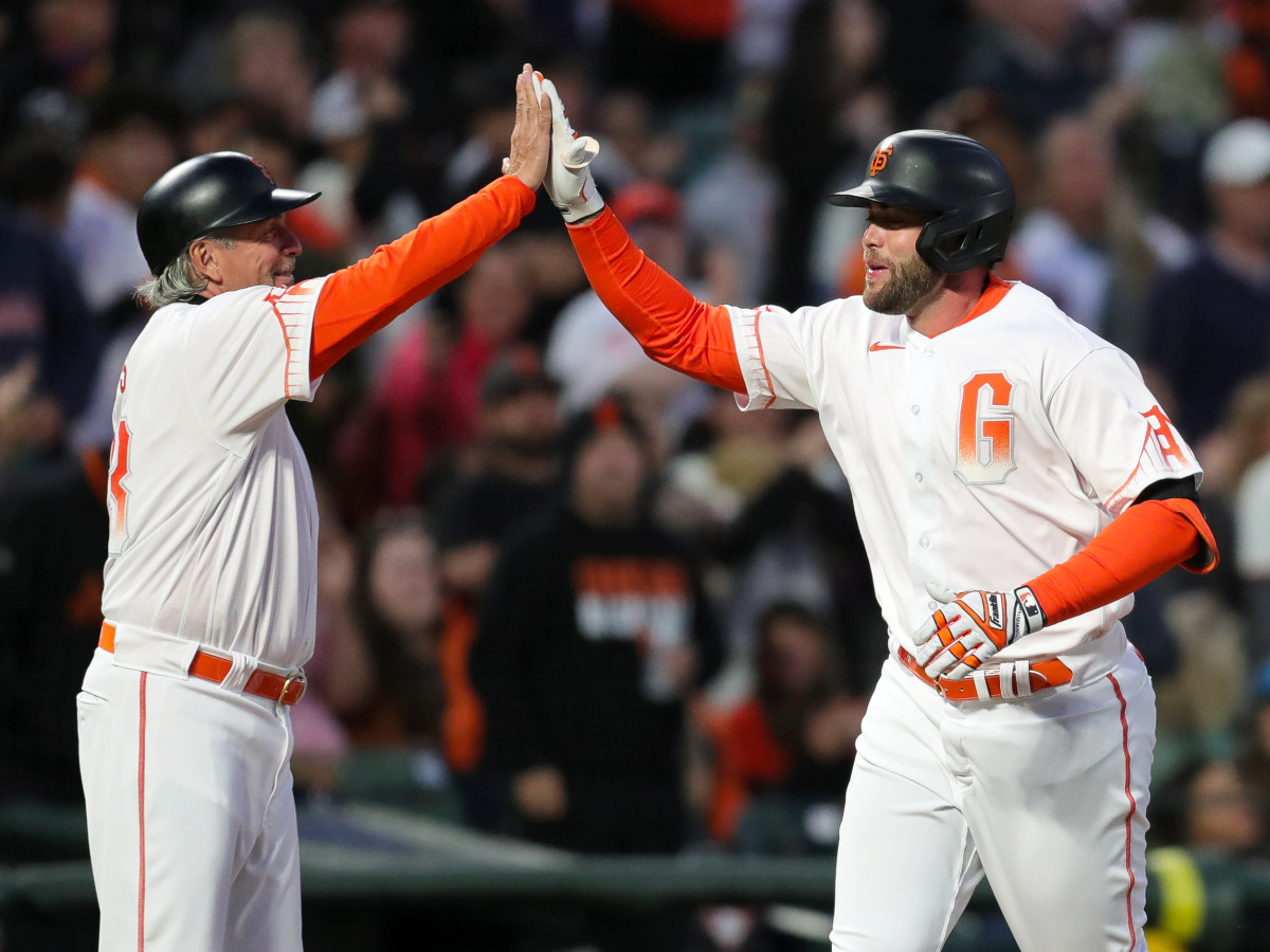 Jul 9, 2021; San Francisco, California, USA; San Francisco Giants first baseman Darin Ruf (33) celebrates with third base coach Ron Wotus (23) after hitting a home run during the fifth inning against the Washington Nationals at Oracle Park.