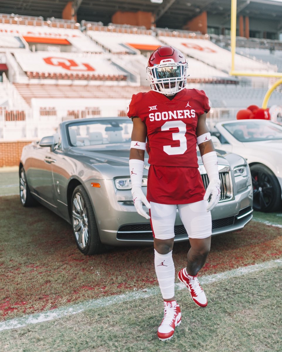 Brown poses on the field during his Oklahoma official visit.