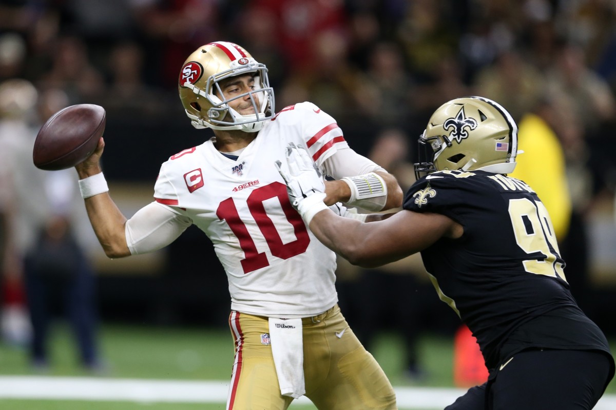 San Francisco 49ers quarterback Jimmy Garoppolo (10) is pressured by New Orleans Saints defensive tackle Shy Tuttle (99). Mandatory Credit: Chuck Cook-USA TODAY 