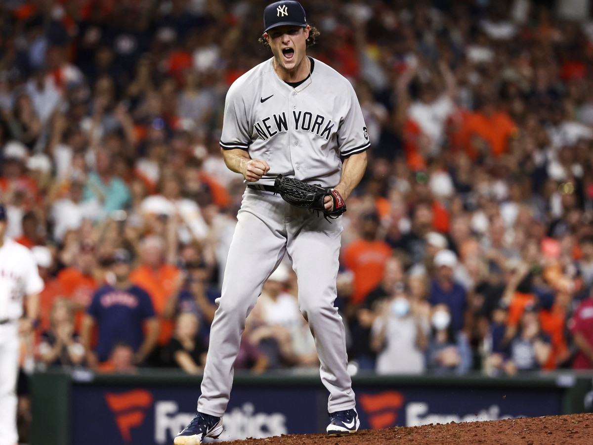 Jul 10, 2021; Houston, Texas, USA; New York Yankees starting pitcher Gerrit Cole (45) reacts after recording a strikeout against the Houston Astros to end the game at Minute Maid Park.